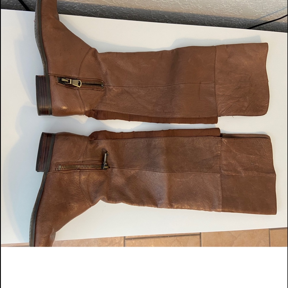 Brown knee-high women’s boots leather